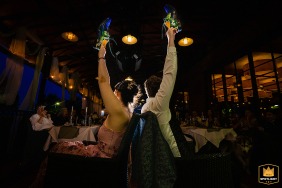 At Trio Grill, Falls Church, VA, the bride and groom play a knowing-each-other game at the reception, seated back-to-back and backlit.